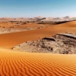 dried-ground-with-sand-in-namib-desert-during-suns-A2A5NG6.jpg